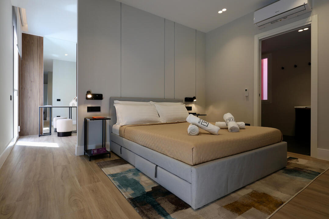 Ample space in the master bedroom with a walk-in closet and an ensuite bathroom. Ample space in the master bedroom with a walk-in closet and an ensuite bathroom.