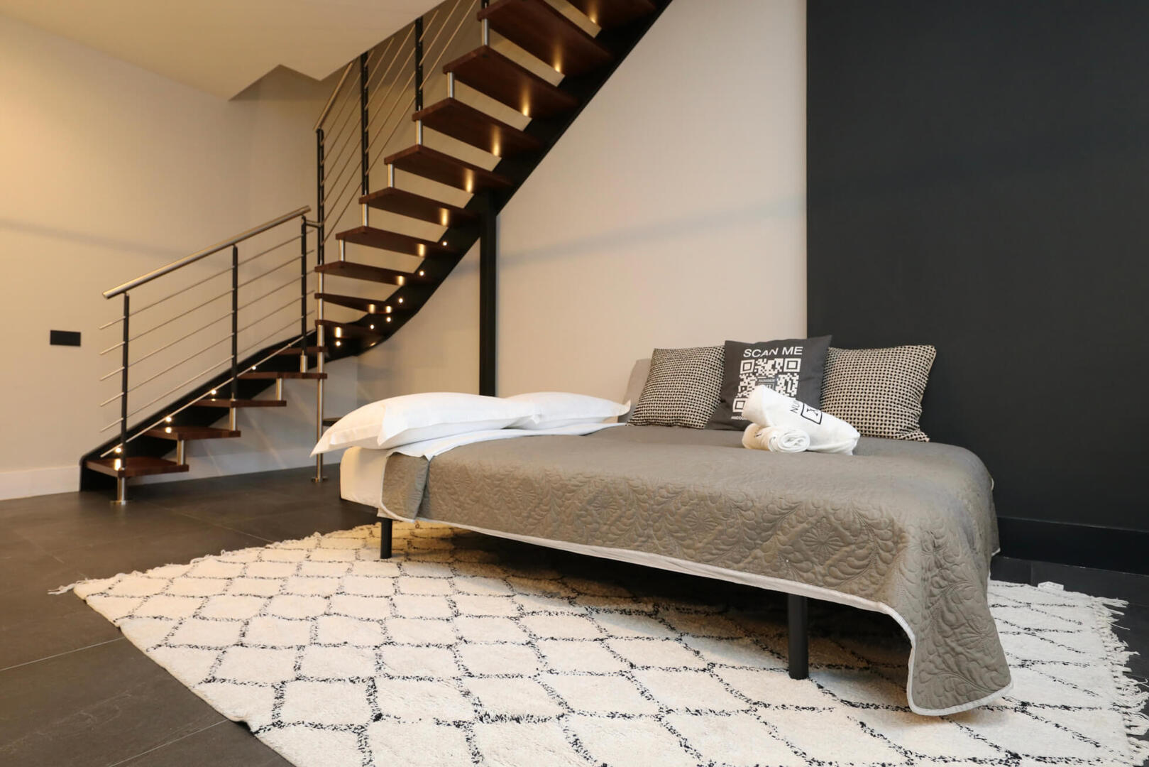 The comfy sofa bed converts into a person bed with an added topper mattress.